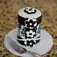 Cakelet Personal Cake three cupcakes stacked, covered in bc with lucks shimmer ribbon and damask icing sheets and fondant details.