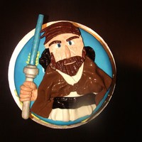 Star Wars Obi Wan Kenobi Cake Obi Wan and lightsaber are made of fondant. This was made for a little boy who loves Star Wars