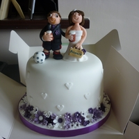 Small Wedding Cake With 250 Cupcakes vanilla sponge top tier covered in fondant with gum paste models and flowers with 250 matching cupcakes