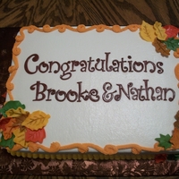 Fall Wedding Fall themed wedding cake. WASC with strawberry cheesecake filling and butter cream frosting. Leaves are gumpaste.
