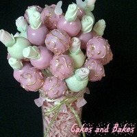Pink And Gold Cake Pops pink and gold themed baby shower. fondant rose cake pops and pink pops with golden scrollwork.