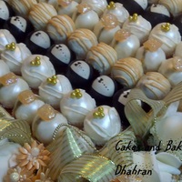 Wedding Cake Balls peach and gold themed wedding cake balls diamond ring, bride, groom, stripes.