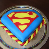 Superman Superman logo cake made with a friend for another friend's birthday.2 layers of brownies inside with chocolater buttercream. All...