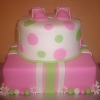 Baby Shower Cake German chocolate cake at top and carrot cake at the bottom.Covered in fondant with fondant decor.