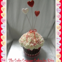 Valentines Giant Cupcake Yellow cake with buttercream icing and border with valentine corn.