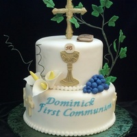 First Holy Communion Cake Cross is chocolate, bible is gum paste, chalice and Eucharist are hand made, with gum paste ivy, modeling chocolate grapes, chocolate...