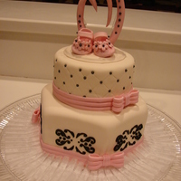 Stencil, Quilted Baby Shower Cake Bottom tier chocolate with white buttercream, covered with fondant.Top tier white with white buttercream, covered with fondant. The shoes...