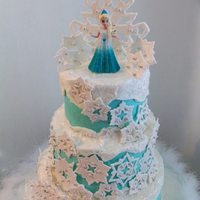 Disney's Frozen Cake iced in buttercream, snowflakes and topper made with gumpaste/fondant mix. *