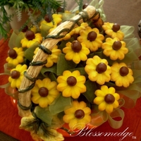 Yellow Sunflower Cookies A sunflower cookie bouquet with malt balls for the center of the cookies...