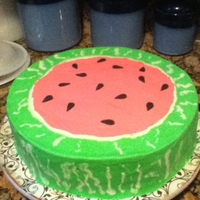 Slice Of Watermelon Vanilla cake dyed with pink and mini chips (for seeds), BC icing and fondant seeds.