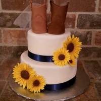 Country Style Bridal Cake Bridal shower cake with a country flair. Sunflowers and boot couple are made of gumpaste.