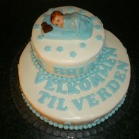 Welcome To The World Chocolate cake with rasberry filling and mmf cover.Velkommen til verden means welcome to the world in norwegian.