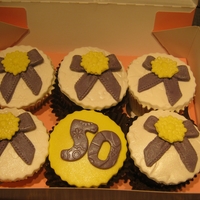 Pretty Bow And Brooch Cupcakes Rose and chocolate flavoured cupcakes decorated with edible sugar bow and brooch. Bow and brooch made with Karen Davies moulds. Made this...