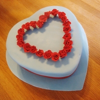 Valentine's Cake For My Sweetheart wedgewood blue heart shaped cake with red sugar roses