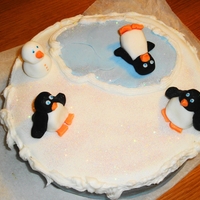 Penguin Pond Snowy Christmas Cake A 9" round, rich fruit cake for Christmas. Decorated with Fondant, Royal Icing and hand modelled penguins