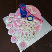 Bubbles Birthday Cake This is my first experience with fondant and also with a tiered cake. A friend wanted a bubble themed cake for her daughter's 1st...