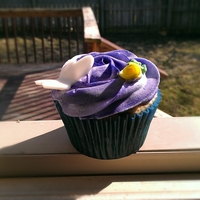 Butterfly Rose Cupcake 1M tip, fondant butterfly cut out, and fondant roses.