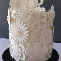 White Cut Out Flower Wedding Cake A Double Barrel Chocolate Mud with ganache.The bride supplied a picture of a similar cake by Pamela McCaffrey~Made With Love~.