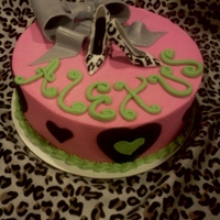 Diva Cake 8" round vanilla cake with vanilla buttercream and fondant accents...high heels are plastic