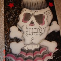 Skull Cake 1/2 sheet rockabilly cake I did for my nephews 30th birthday! Did from photo my niece sent to me. Was a big hit.