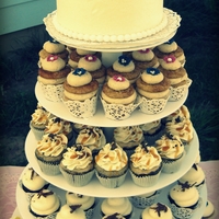 Wedding Cupcake Tower Wedding cupcakes topped with a cutting cake for the bride & groom