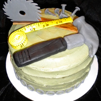 Tools Birthdaycake Fresh strawberry cake with fresh strawberry filling, buttercream icing and fondant tools.