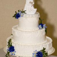 Round Wedding Cake top 2 layers - French Vanilla with raspberry/pineapple/apricot jam in the middleBottom layer - Chocolate Fudge with same jam in the middle...