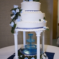 3 Tierd Round Wedding Cake French vanilla with raspberry jam in the center.