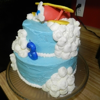 Airplane Cake Gumpaste airplane with buttercream covered cake and clouds. Clouds dusted with shimmer.