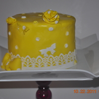 Yellow And White I am new to cake decorating and I have been practicing a lot. This is one of my practice cakes. I used the WASC recipe!