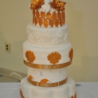 White And Gold I made this for a friend's 50th b'day party. It had banana cake , chocolate and vanilla with white chocolate cream cheese IMBC.