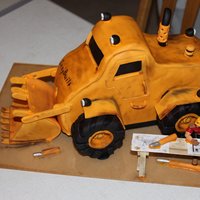 Izzy Built Dozer My husband and some of his friends are into high-end radio controlled construction equipment and semi-trucks. They are having a display...