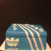 Adidas Adidas Shoe box Cake. Vanilla cake filled with fresh strawberries and banana custard. Meringue buttercream icing