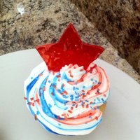 4Th Of July Cupcake Red with a blue funfetti cake topped with non dairy whip and a jolly rancher star!