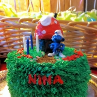 Smurf Cake SMBC, fondant accents. house is made of 2 upside-down cupcakes. Smurf is a toy