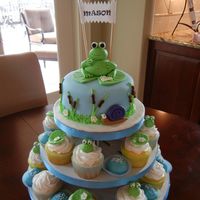 Frog Themed Cake & Cupcake Tower I made this for a friends baby shower. The cake is white with raspberry filling. There are 2 flavors of cupcakes - 1 white with rasp...