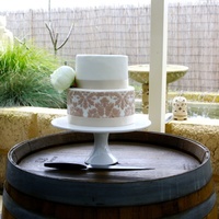 Sisters Engagement Cake First time covering a cake with fondant and first time stencilling. Flower is silk and cake is dark choc mud with frangelico choc ganache...