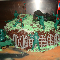 Camo Army Scene Cake We made this for a friends birthday, he loves all things camo or army related :-)Emily & I had a LOT of fun cutting up the little army...