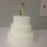 3 Tiered Wedding Cake I used a 14", 10", 8" combo with buttercream frosting. Piped on swirls.