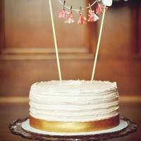 8 Round Birthday Cake With Buttercream Frosting And A Gold Painted Fondant Ribbon 8" round birthday cake with buttercream frosting and a gold painted fondant ribbon.