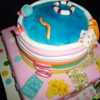 Pool Cake top tier chocolate cake. bottom tier vanilla with strawberry filling.