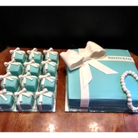 Tiffany Gift Box Cake And Ring Box Cupcakes These are covered in fondant. I ended up using mirrors as the cake boards to fancy them up a little more and added sugar pearls around the...