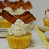 Maple Bacon Pancake Cupcakes MAPLE-BACON-PANCAKE-CUPCAKES! Pancake batter cupcakes filled with a pat of butter, covered with our new Silky Buttercream, drizzled with...