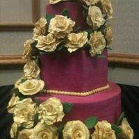 Wedding Cake *Fuchsia wedding cake with handmade gold sugar flowers.