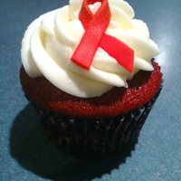 Als Awareness Red Velvet Cupcake Red Velvet cupcake with cream cheese frosting, and a fondant ALS Awareness ribbon.