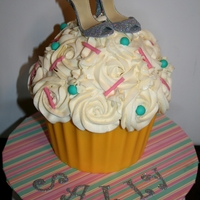 Glitter Shoe Giant Cupcake Giant Vanilla Cupcake with handmade gumpaste shoes. Base is wilton yellow candy melts, thanks for looking!