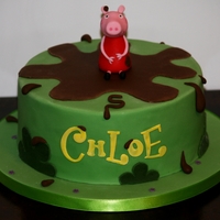 Peppa Pig Peppa cake, chocolate cake filled with chocolate buttercream and covered in chocolate ganache. Design is by the Little Cherry Cake Company...