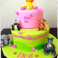 Pink And Green Jungle Animals Cake The Lionmonkeyzebrabear And The Elephant Made Out Of Gum Paste Pink and green Jungle Animals Cake. The lion,monkey,zebra,bear and the elephant made out of gum paste.