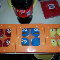 Sesame Street Elmo, Cookie Monster, and Big Bird. Vanilla cupcakes with Betty Crocker icing. Candy eyeballs. Fondant accents. 'Nilla Wafers in...