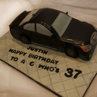 Infiniti G37 Cake Hi there! This cake was made for a guy who LOVES Infiniti cars. I carved a chocolate cake with chocolate buttercream and covered with...